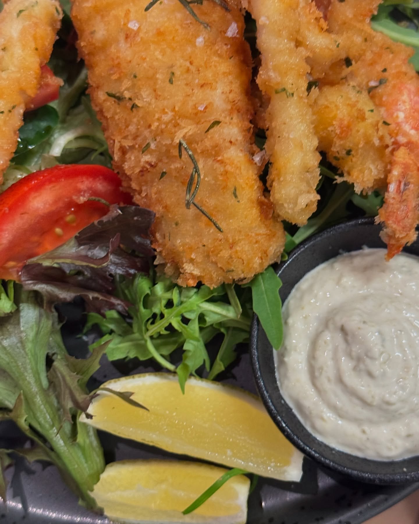 Crumbed seafood with salad, lemon and aioli