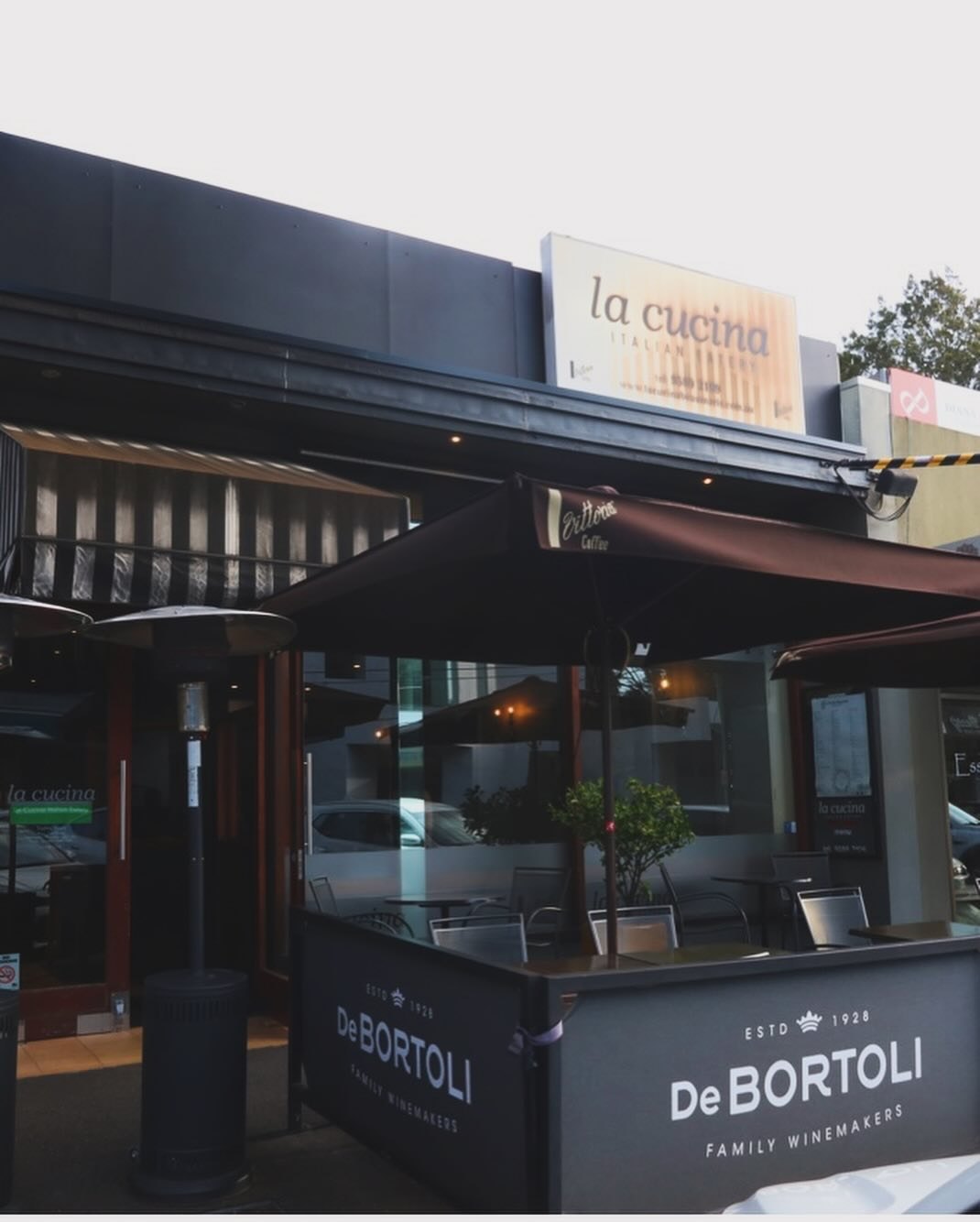 The La Cucina courtyard on North Concourse with umbrellas and heaters