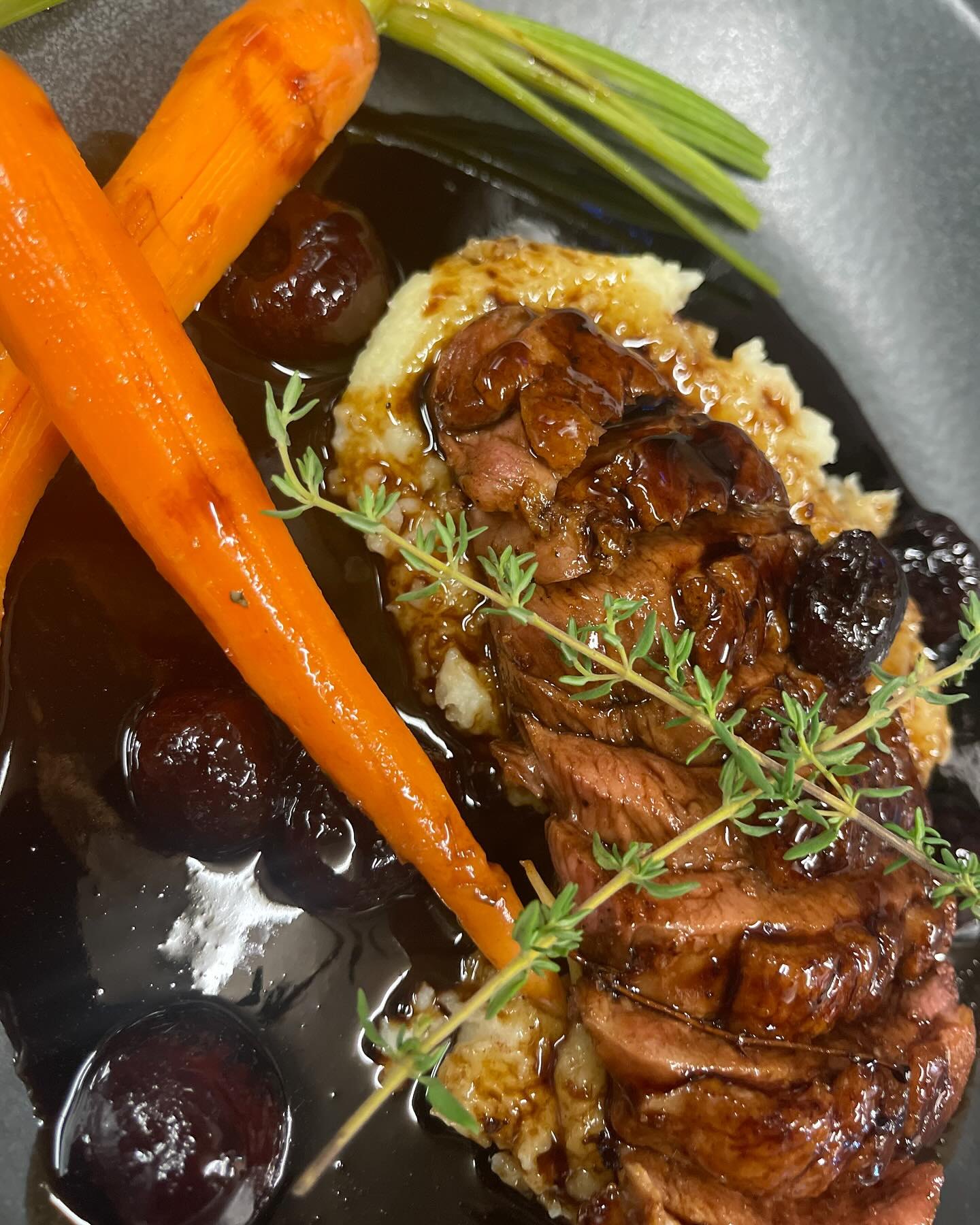 Slow roasted duck with mash and roasted carrots